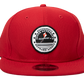 Red snap back baseball cap with IAOA seal center front
